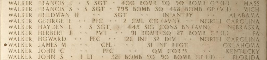 A rosette next to the name of Cpl. James M. Walker on the Walls of the Missing at Manila American Cemetery signifies he has been identified. (Photo: American Battle Monuments Commission)