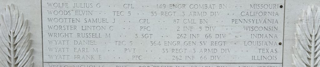 A rosette next to the name of Tech. 5 Daniel Wyatt on the Walls of the Missing at Normandy American Cemetery signifies he has been identified. (Photo: American Battle Monuments Commission)