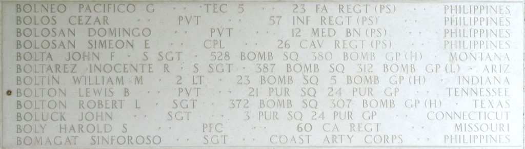 A rosette next to the name of Pvt. Lewis B. Bolton on the Walls of the Missing at Manila American Cemetery signifies he has been identified. (ABMC photo)
