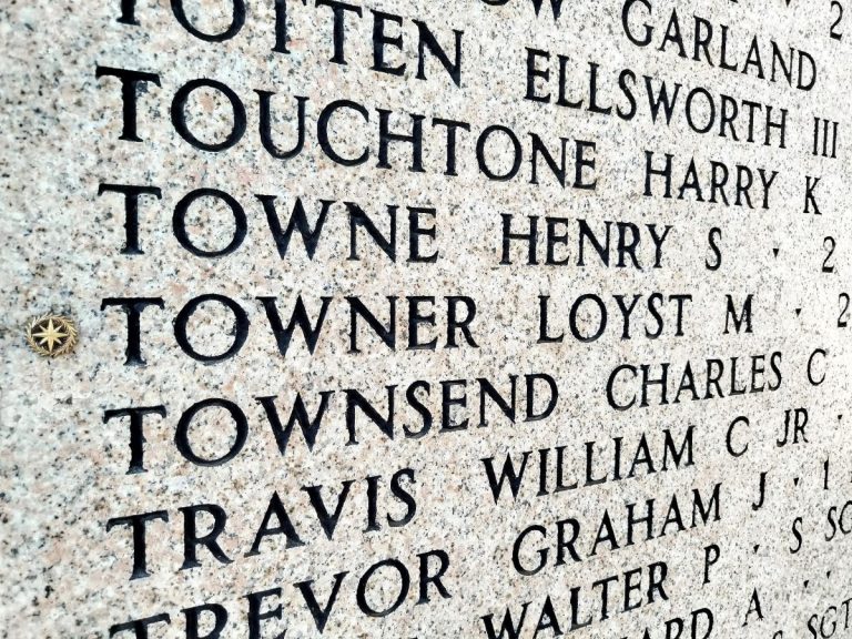 A rosette next to the name of 2nd Lt. Loyst M. Towner on the Walls of the Missing at Florence American Cemetery signifies he has been identified. (ABMC photo)