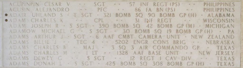 A rosette next to the name of Cpl. Charles K. Adam on the Walls of the Missing at Manila American Cemetery signifies he has been identified. (ABMC photo)