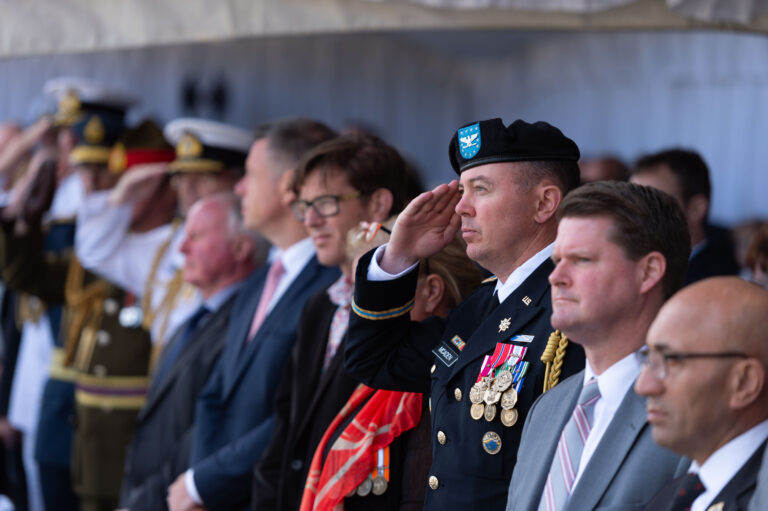 Attendees stood during parts of the New Zealand Memorial Dedication Ceremony.