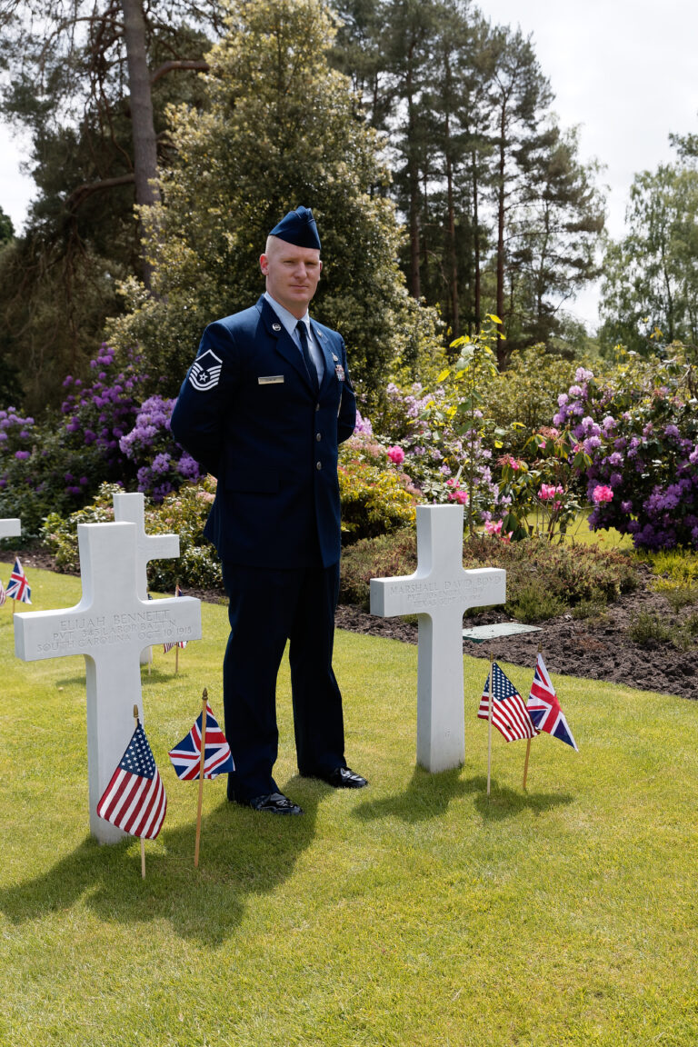 An airman stands next to headstones during Memorial Day Weekend 2017 at Brookwood American Cemetery. Image courtesy of Anthony McCallum.