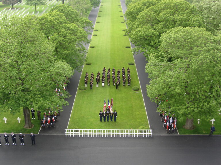 Troops stand in formation during the 2016 Memorial Day Ceremony at Brittany American Cemetery.