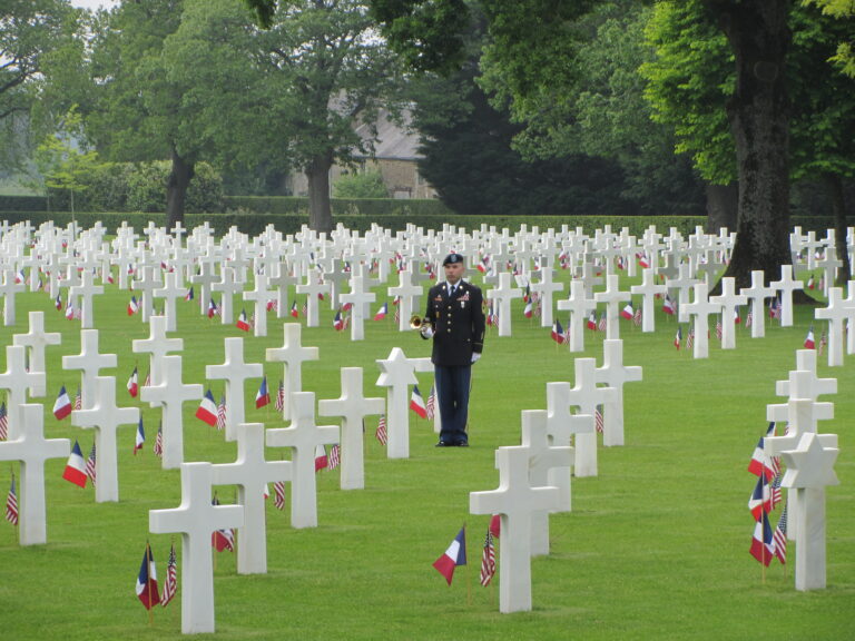 MSgt. Laurence Dean of  the U.S. Army Europe Band and Chorus waits to play "Taps" during the 2016 Memorial Day Ceremony at Brittany American Cemetery.