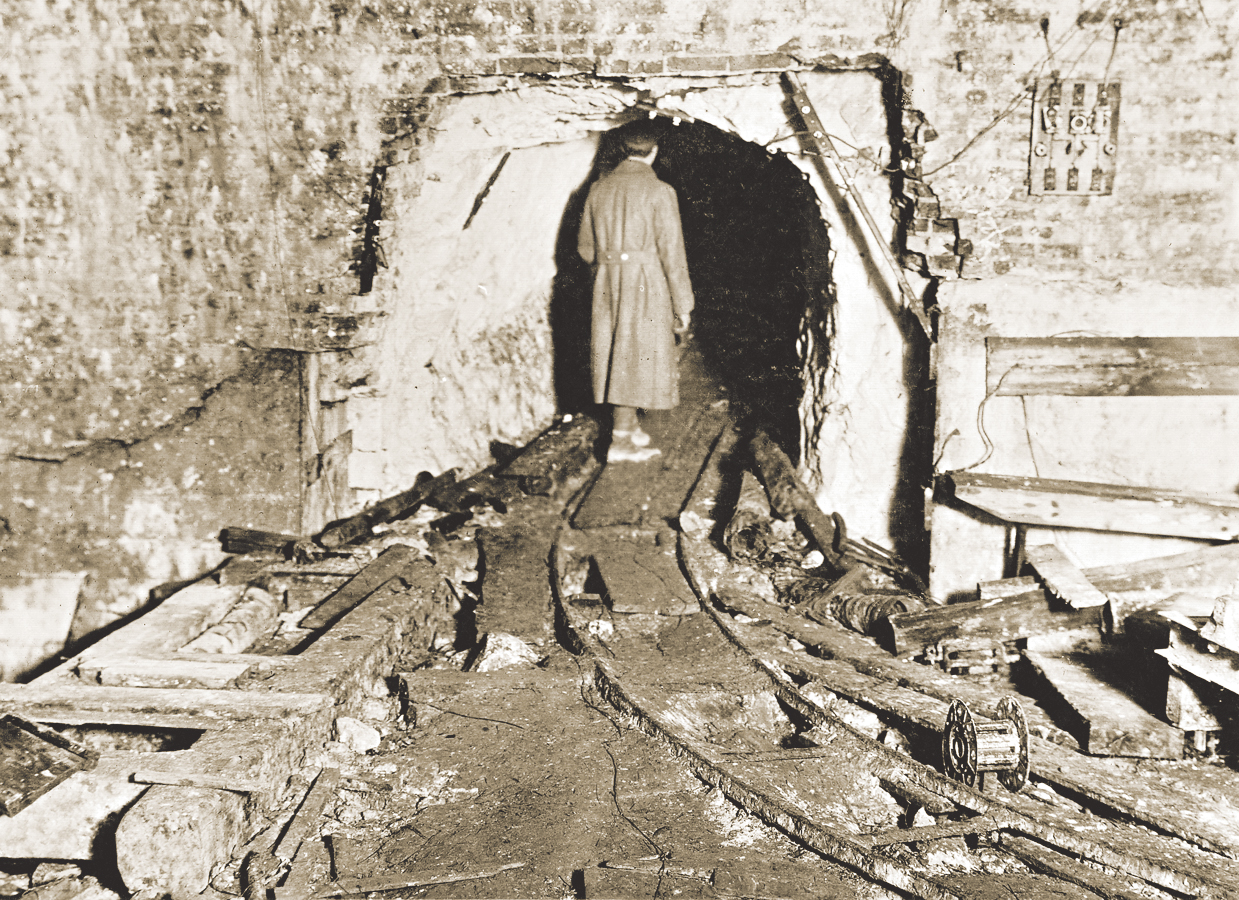 An American soldier explores one of the entrances Germans dug into the ...