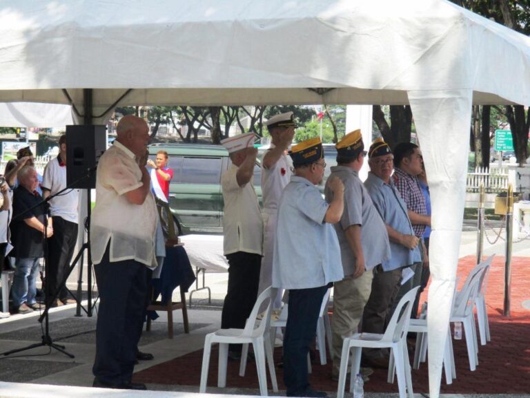 Attendees stand during the 2016 Memorial Day Ceremony at Clark Veterans Cemetery.