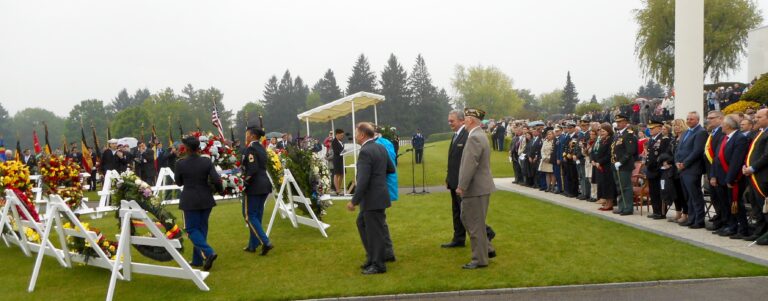 Superintendent Bobby Bell and Assistant Superintendent Lou Aske escort WWII veterans during the wreath laying at Henri-Chapelle American Cemetery as part of the 2015 Memorial Day Ceremony.