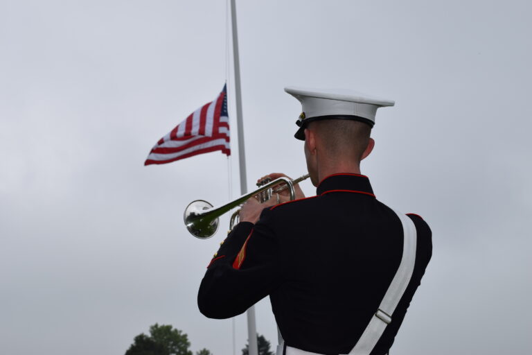 A U.S. Marine participates in the 2016 Memorial Day Ceremony at Aisne-Marne American Cemetery.