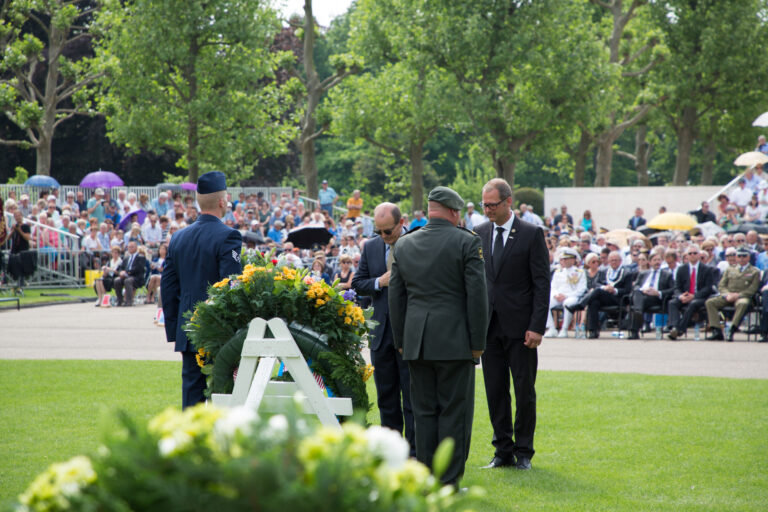 ABMC representatives lay a wreath during the 2017 Memorial Day Ceremony at Netherlands American Cemetery.