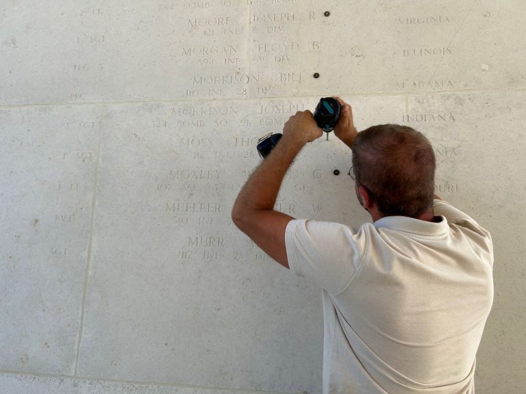 A rosette is installed at Henri-Chappelle American Cemetery.