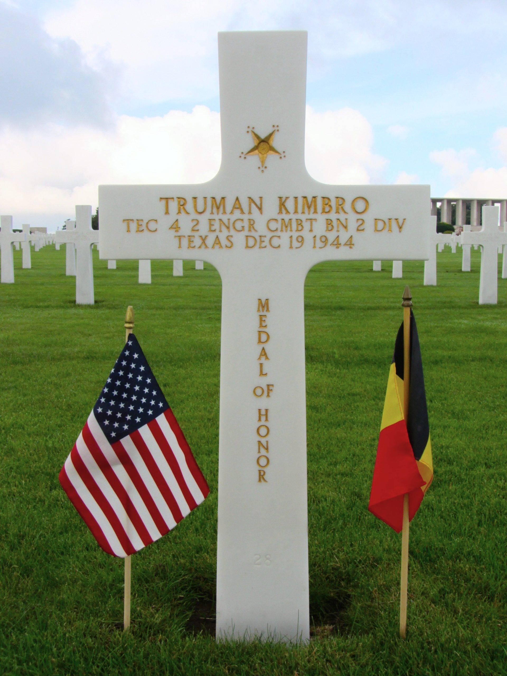 Picture of the headstone of Tech. Fourth Grade Truman Kimbro at Henri-Chapelle American Cemetery. Credit: American Battle Monuments Commission.