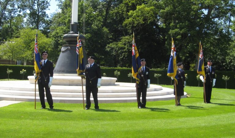 Flag bearers participate in the ceremony at Cambridge American Cemetery as part of the annual Allied Memorial Ride on July 4