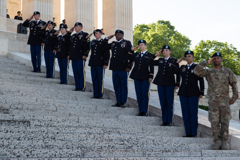 American soldiers salute during the dedication ceremony for the new visitor center at Chateau-Thierry American Monument. Photo credit: Julien Nguyen-Kim/American Battle Monuments Commission.