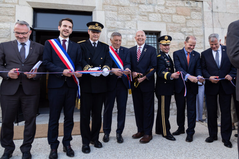 Members of the official party cut the ribbon during the dedication ceremony for the new visitor center at Chateau-Thierry American Monument on May 27