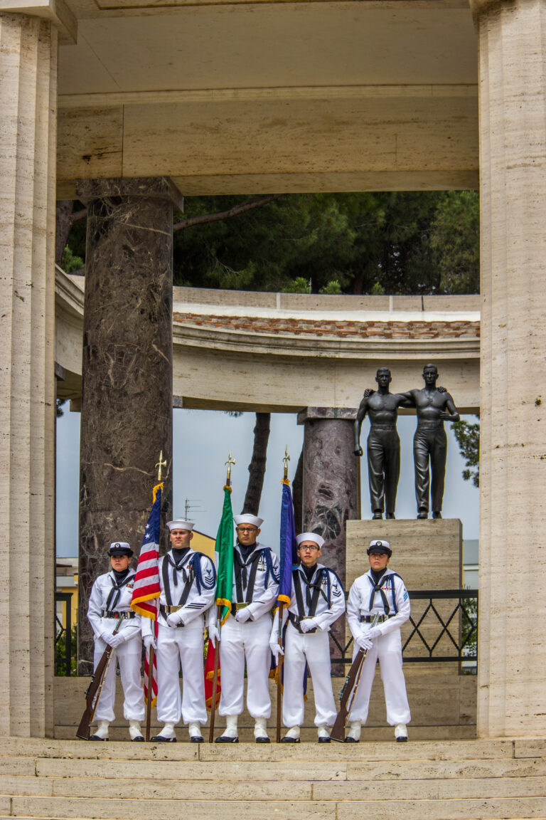 A U.S. Honor Guard stands in front of the Brothers-in-Arms statue during the 2016 Memorial Day Ceremony at Sicily-Rome American Cemetery.