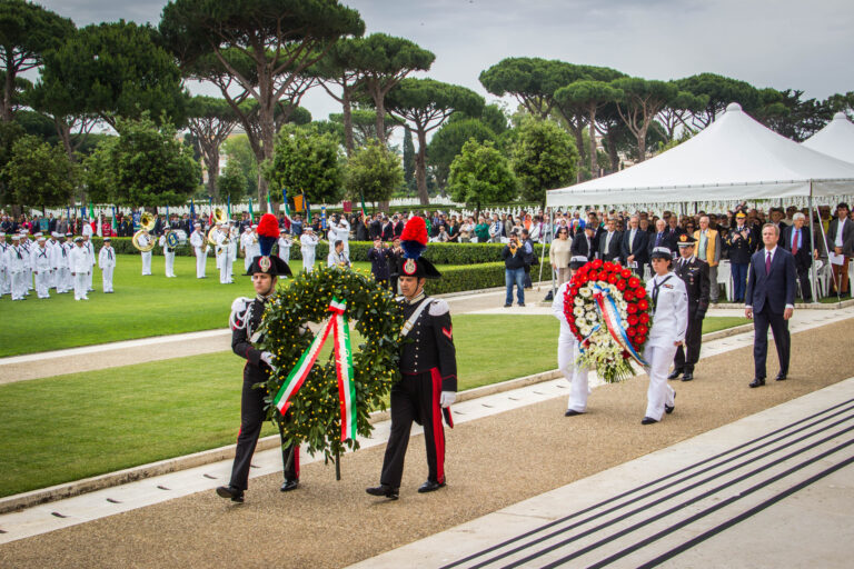 Members of the military assist with the wreath laying during the 2016 Memorial Day Ceremony at Sicily-Rome American Cemetery.