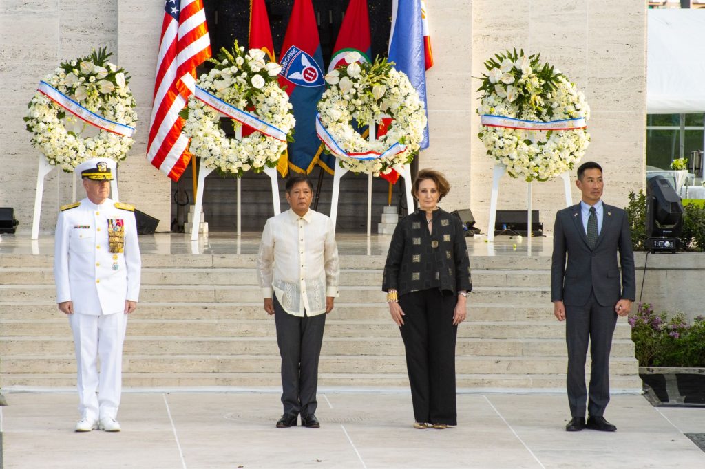 U.S. Indo-Pacific Commander Adm. Samuel Paparo, President of the Republic of the Philippines Ferdinand R. Marcos Jr., U.S. Ambassador to the Philippines MaryKay L. Carlson, and American Battle Monuments Commission Secretary Charles K. Djou stand in front of the wreaths Feb. 22 during the 80th commemoration of the liberation of Manila at the Manila American Cemetery.