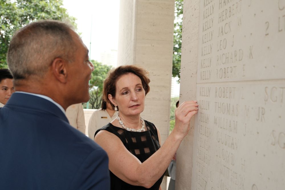 A bronze rosette is placed next to the name of Thomas V. Kelly on the Tablets of the Missing