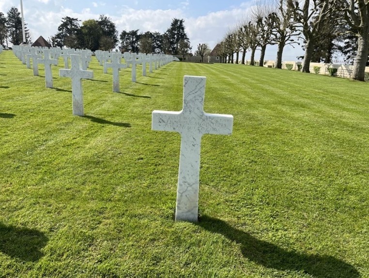 Picture of the headstone that contains the remains of seven unknown service members, the cemetery’s final burial in 1972. Credit: American Battle Monuments Commission.