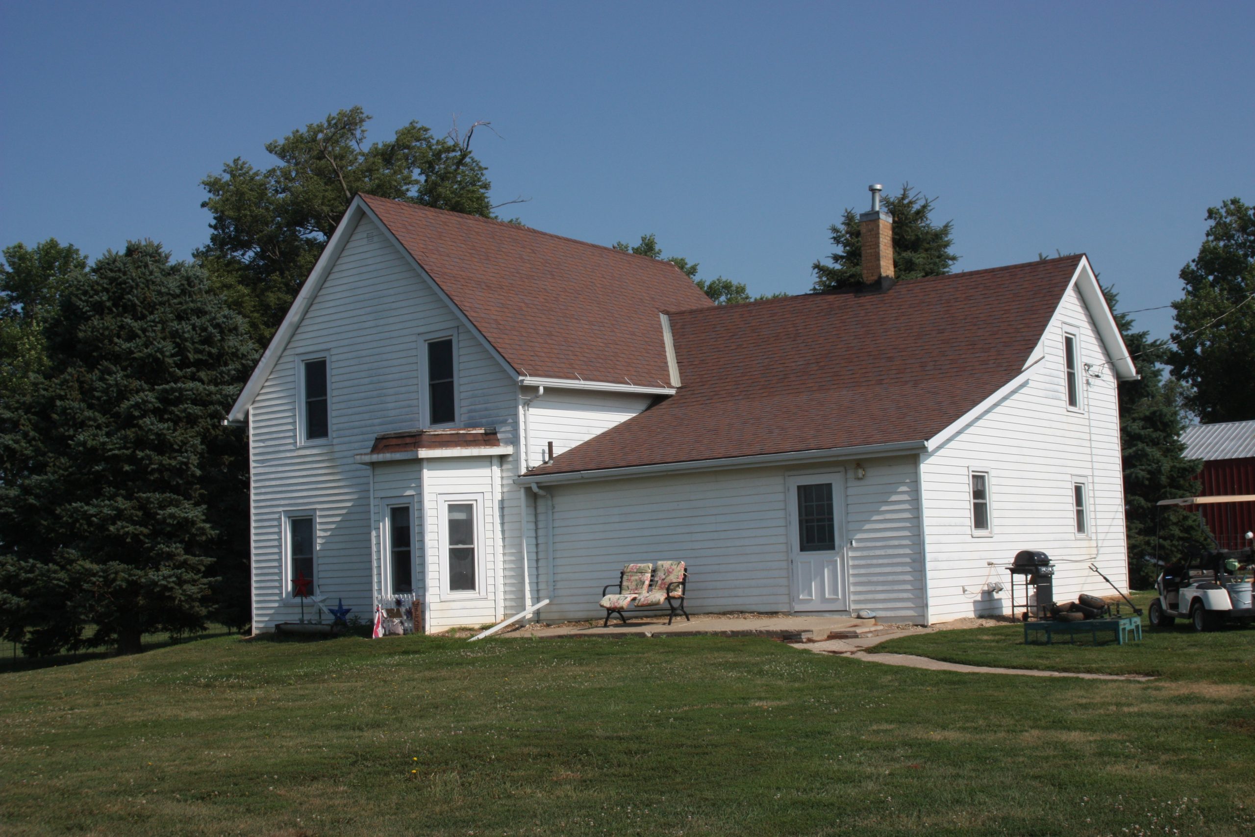 Exterior view of a white house with multiple windows.