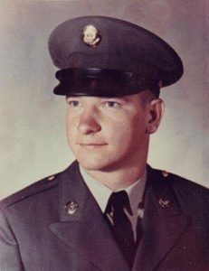 Studio portrait of a Sergeant First Class Donald “Don” Lee Sparks, in military dress uniform and cap