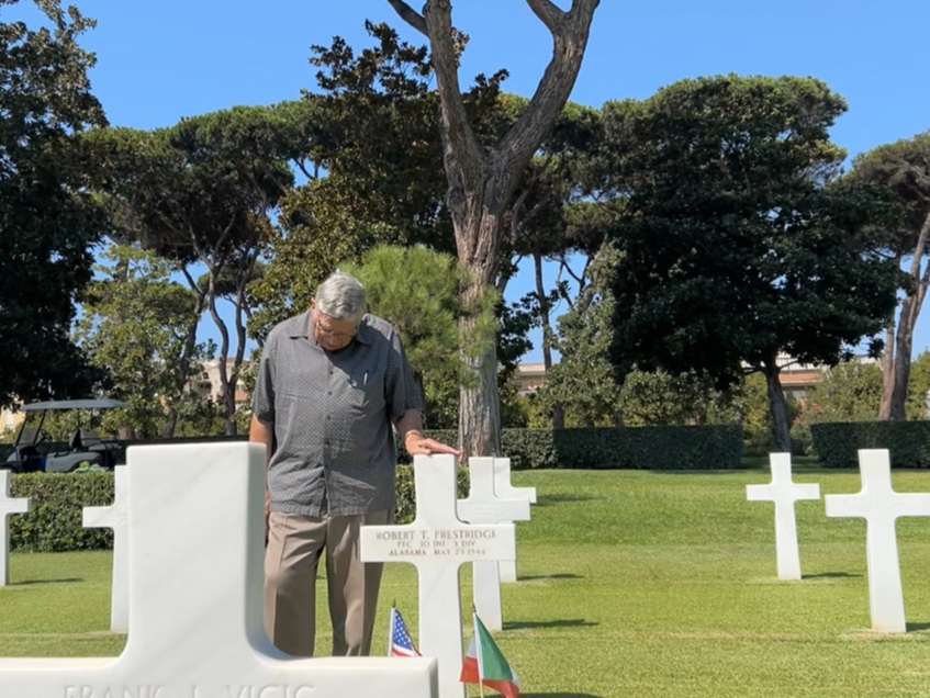 Travis Prestridge stands at his father’s grave for the first time in August 2024.