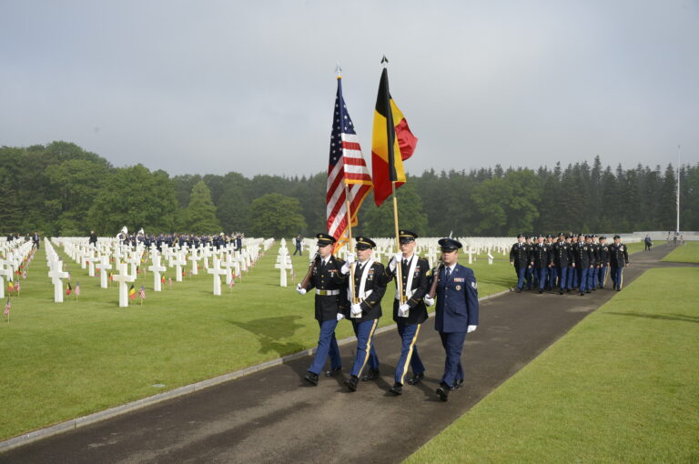 An American Honor Guard marches in during the 2016 Memorial Day Ceremony at Ardennes American Cemetery. Image courtesy of Brussels Embassy