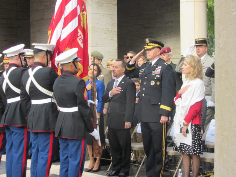 Ceremony attendees stand during 2016 Veterans Day Ceremony at North Africa American Cemetery.