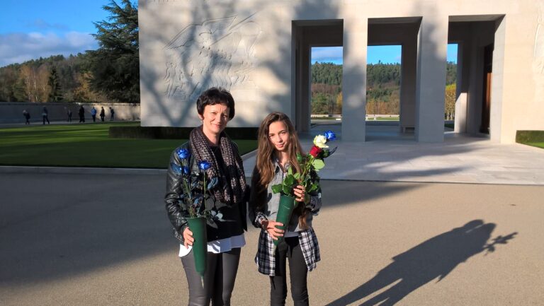 Local citizens came to Epinal American Cemetery on November 11 to bring flowers to their adopted grave sites. These adopters do not clean the headstones